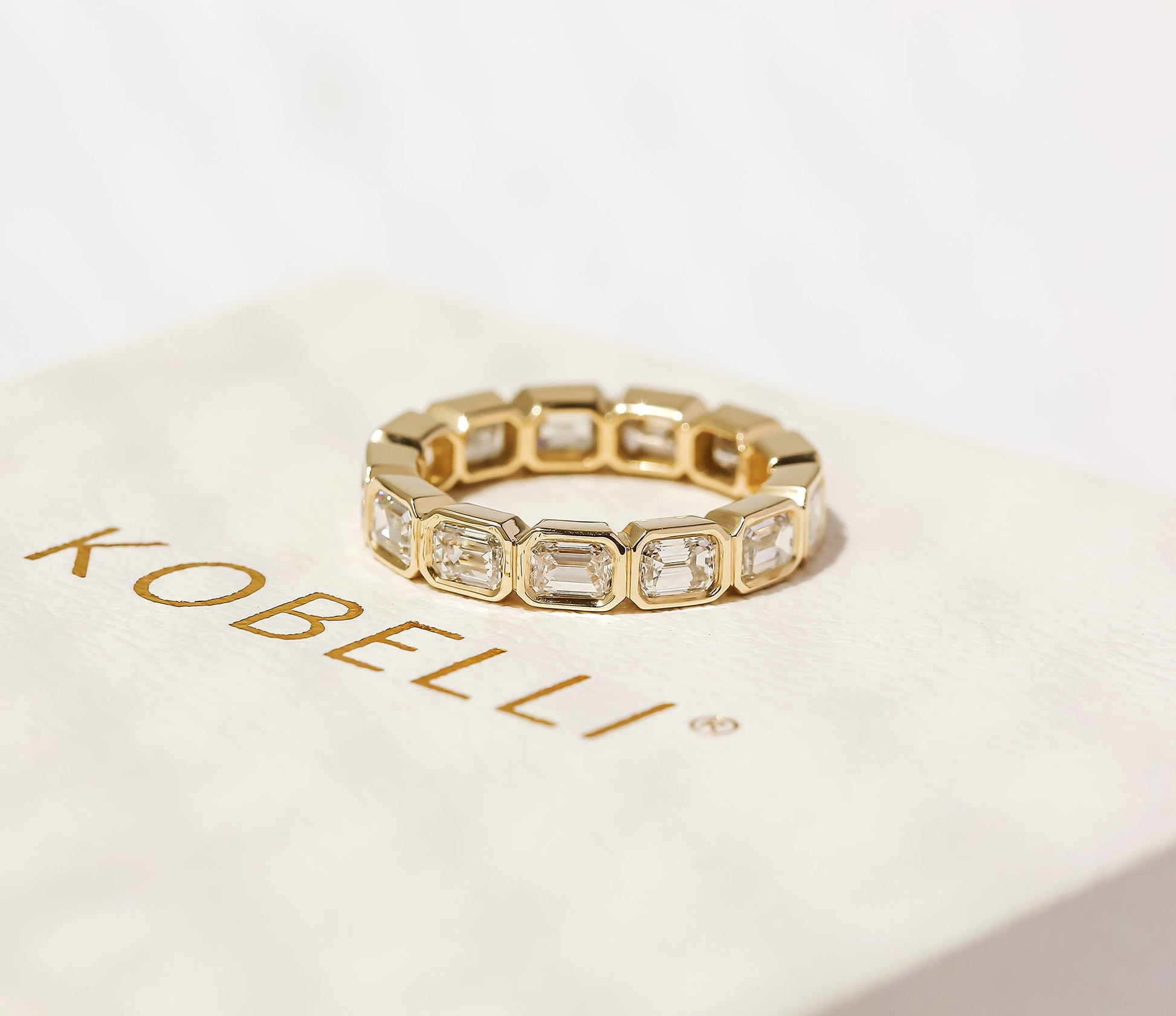 Kobelli Lab Grown Emerald Diamond Bezel Eternity Band - Lifestyle Image