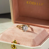 Anel de noivado Kobelli redondo moissanite e diamante pequeno