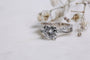 Kobelli 2 Carat Lab-grown Diamond Accented Ribbon Bypass Moissanite Engagement Ring