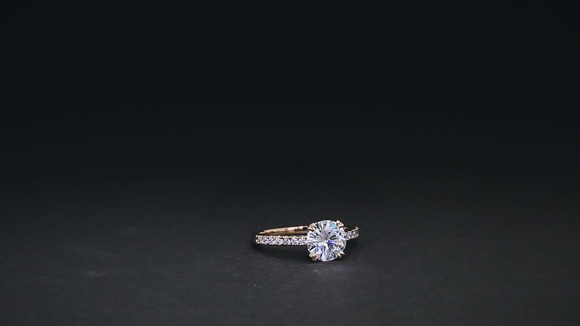 video of round centered engagement ring with diamond-lined band