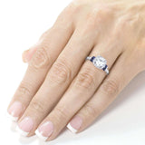 Anel de noivado de moissanite de corte redondo Kobelli com diamante e safira 1 3/5 CTW ouro branco 14k